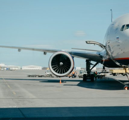 white airliner on runway